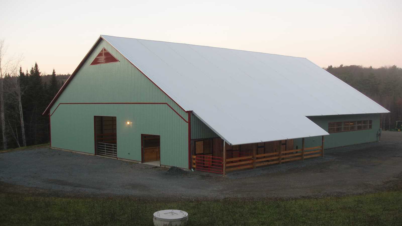 Exterior of a 85’ x 120’ fabric roof riding arena.